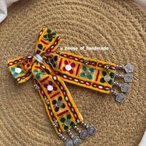 Handmade Navratri hair bow with colorful Kutchi embroidery, mirror work, and cowrie shells – festive traditional hair accessory